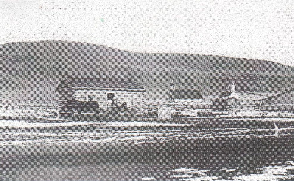A big bare hill and not much else: Cochrane 1899, showing the church and the Beam house, with St. Mary's Roman Catholic church in the background.