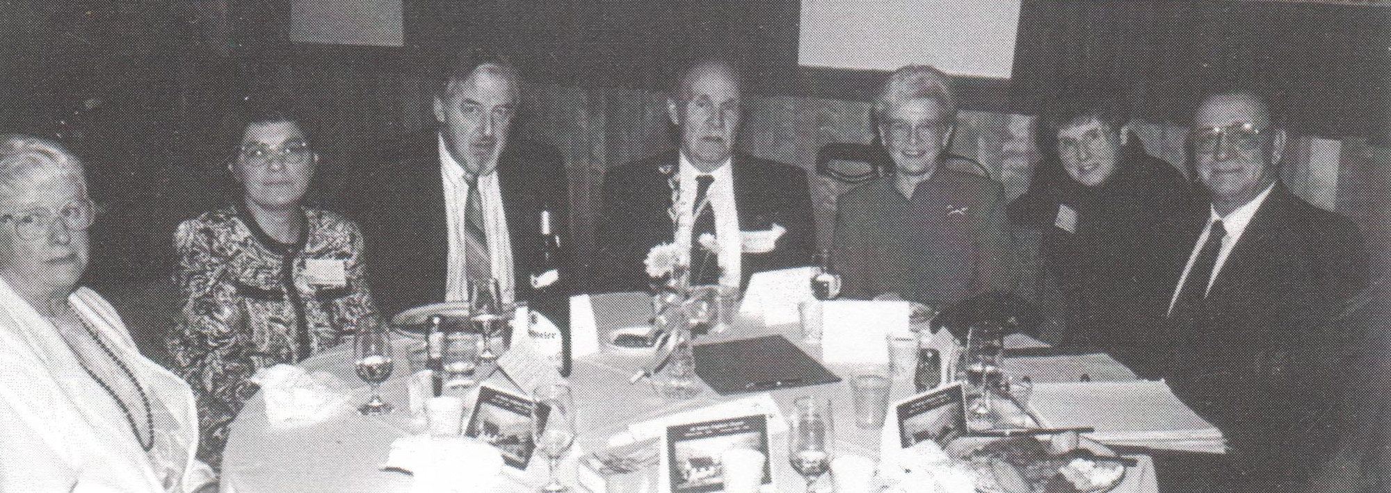 Pauline Murray, Margaret and Peter Hunziker, Jim Kerfoot, Robin Harvie, and Jean and Leigh Blackwell shared at able at the Centennial Anniversary banquet in 1992.