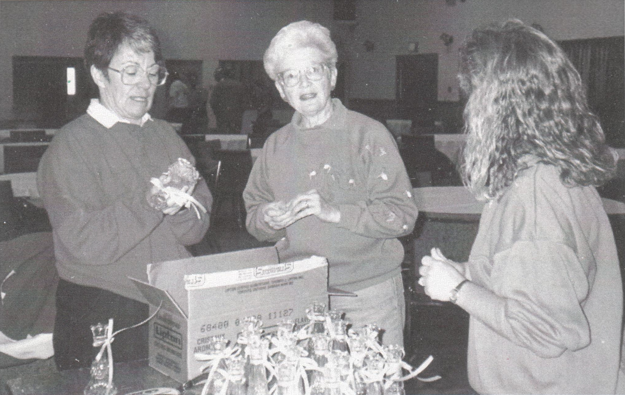 Barb Woodruff, Robin Harvie and Dian Kilburn getting candlesticks ready for the Centennial Anniversary dinner, 1992